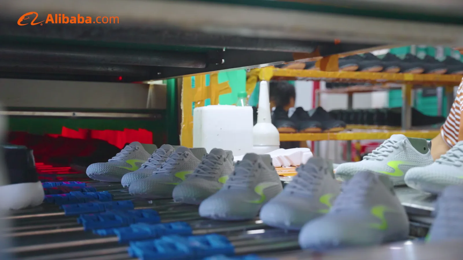 Shoes moving through a production-line handling station