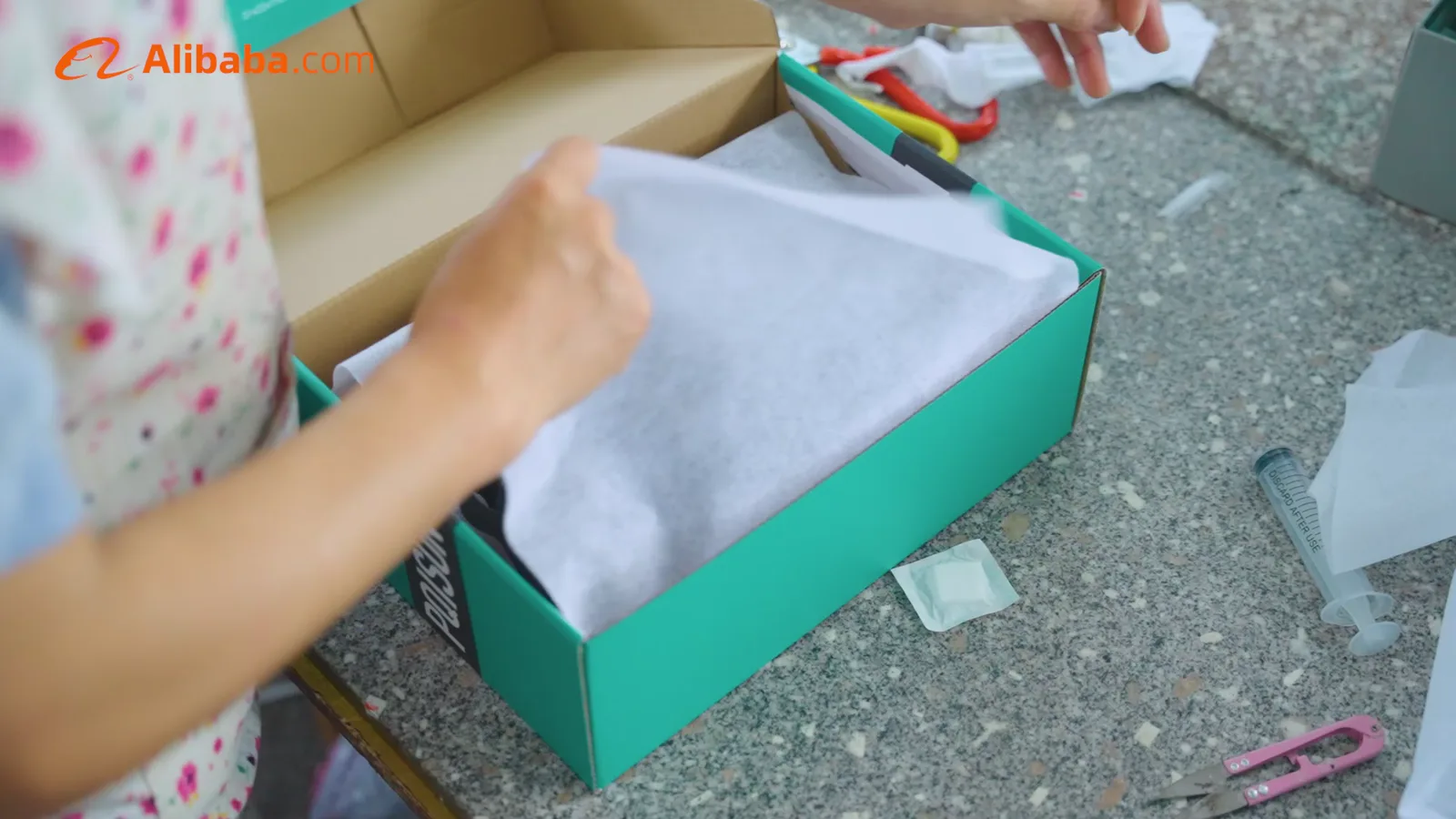 Packing preparation visible in the supplied factory footage